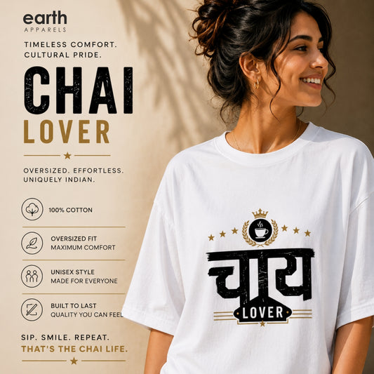 A woman wearing a white short-sleeve graphic T-shirt with a black and gold 'Chai Lover' design, shown against a warm beige background with product feature callouts on the left. The shirt has a bold Hindi word 'Chai' in black with a gold crown and 'LOVER' in a black banner below.