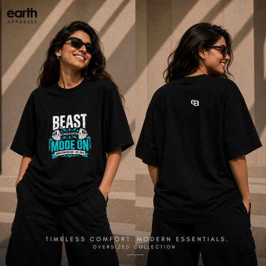Two views of a woman modeling an oversized black graphic T-shirt from Earth Apparel. The front view shows a white and teal graphic reading 'BEAST MODE ON', while the back view shows a small white 'ea' logo on the upper left shoulder.